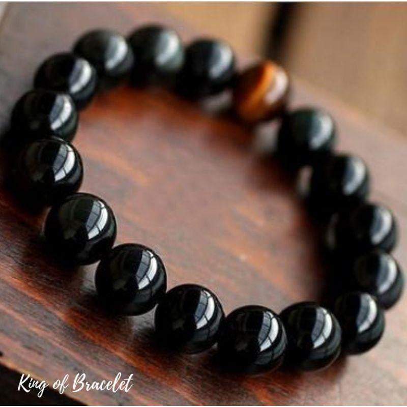Bracelet en Onyx Noir avec perle d’Œil de Tigre – Ancrage & Force Intérieure