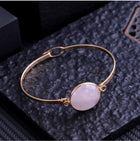 Bracelet "Douceur Infinie" – Jonc Doré & Perle de Quartz Rose Ovale